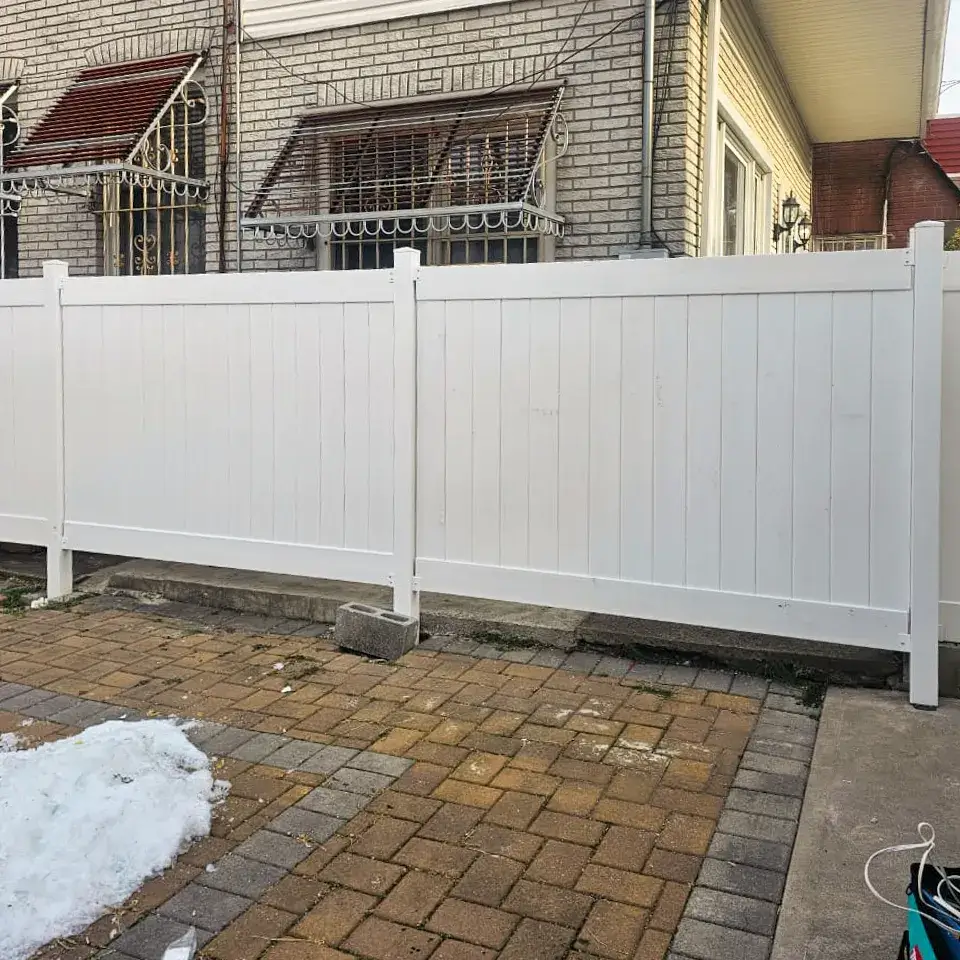 Vinyl backyard fence repair and panel stabilization in North Jersey property